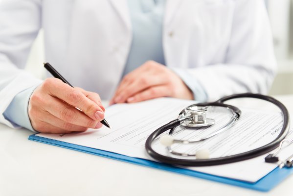 doctor completing chart credit repair